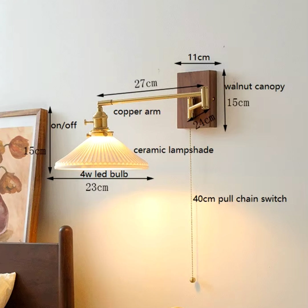 Swing arm sconce mounted on the wall beside a bed in a contemporary bedroom, offering adjustable lighting for reading