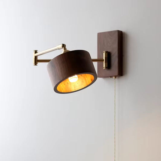 Adjustable swing arm sconce providing directed task lighting in a modern home office.