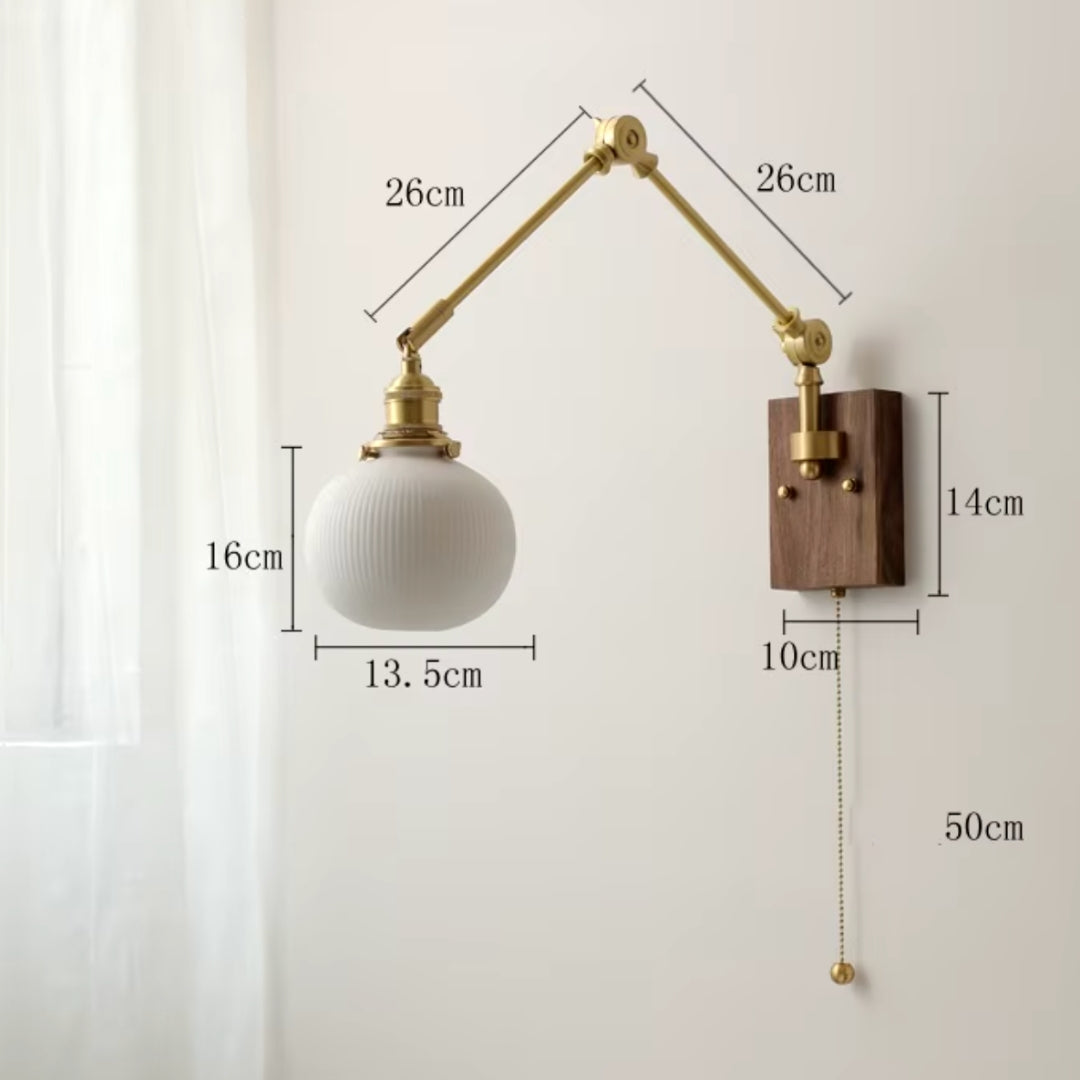 gold swing arm wall sconce for hallway lighting, adding sophistication to entryways