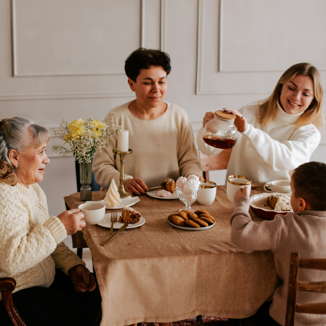 A warm, inviting living room where a family enjoys quality time together, with soft, ambient light from stylish sconces casting a cozy glow on the scene. The perfect atmosphere for family gatherings with elegant wall sconces that enhance home decor and lighting.