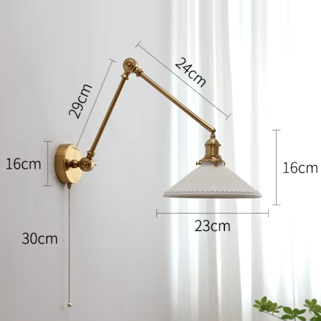 gold swing arm wall light with adjustable arm, ideal for versatile dining room lighting