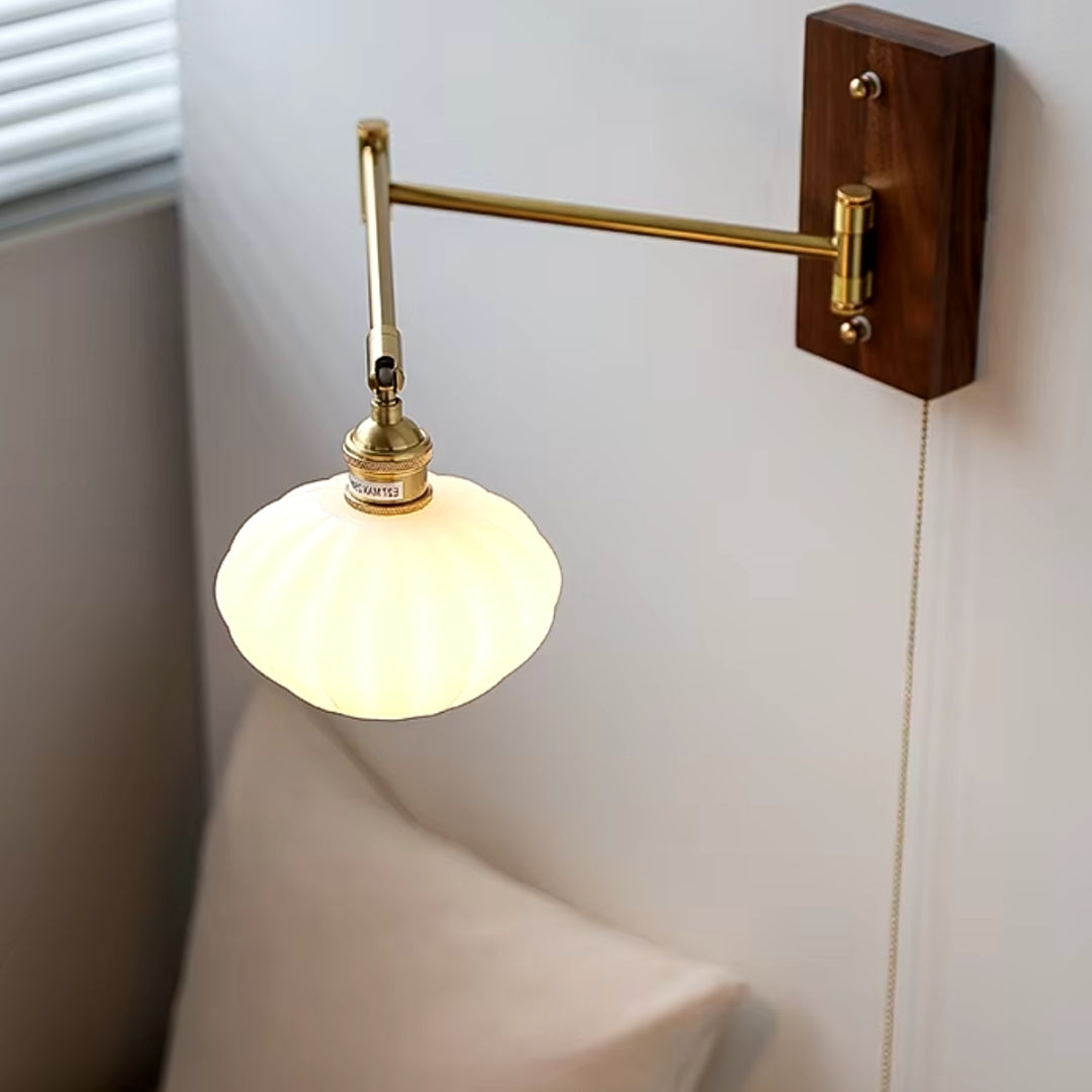 adjustable gold swing arm wall sconce for bedside reading light in your bedroom