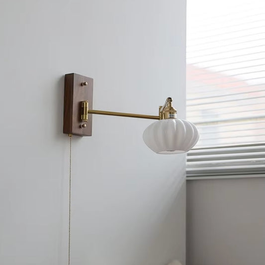 adjustable gold swing arm wall sconce, perfect for task lighting in modern office or study