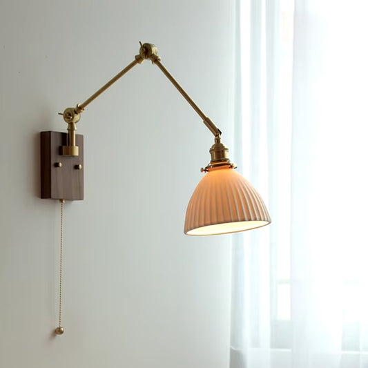 sleek swing arm wall sconce, ideal for reading light next to the bed in the bedroom