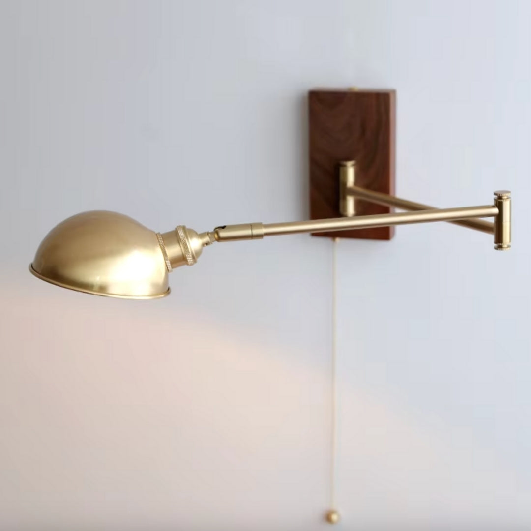 Swing arm sconce featuring an LED bulb, offering energy-efficient lighting and a sleek, modern design for any room