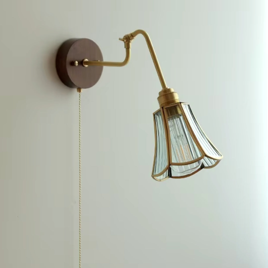 Swing arm sconce mounted on the wall in a cozy reading corner, providing adjustable lighting for a comfortable reading experience